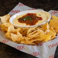 Chili Queso · A combination of queso blanco and our homemade chili, garnished with cilantro. Served with c...