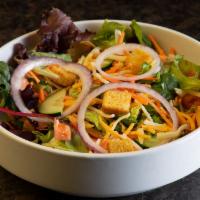House Salad · A blend of mixed greens topped with tomatoes, cucumbers, carrots, red onions, cheddar Jack c...