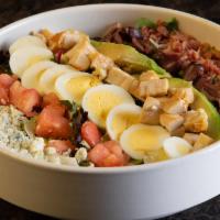 Classic Cobb Salad · A blend of greens with grilled chicken, avocado, hard-boiled egg, applewood-smoked bacon, Ka...