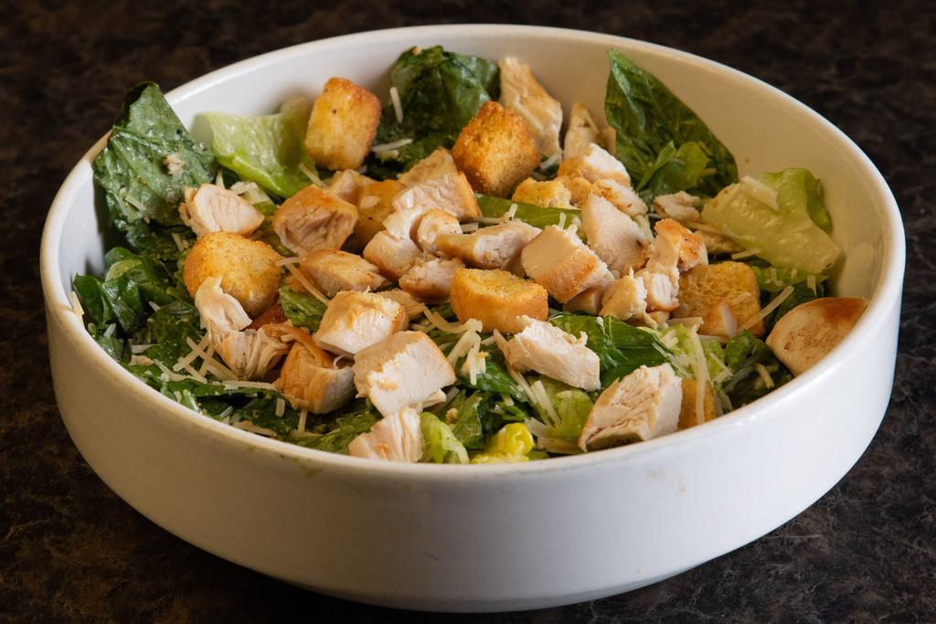 Large Chicken Caesar Salad · Grilled chicken served over romaine lettuce tossed in our Caesar dressing, topped with croutons and shaved Parmesan.