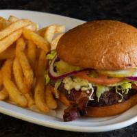 Black and Blue Burger · Seared with Cajun spices topped with melted blue cheese crumbles and applewood smoked bacon....
