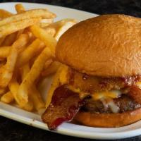 Mavrix BBQ Burger · Topped off with BBQ sauce, applewood smoked bacon, cheddar Jack cheese and of our signature ...