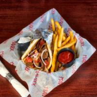 Classic Gyro · Hand carved seasoned gyro meat, grilled and served with red onions and tomatoes in a grilled...