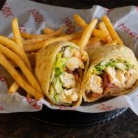 California Chicken Wrap · Grilled chicken breast with lettuce, avocado, tomato, bacon and our sriracha lime cream in a...