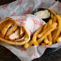 Chicken Pita · Seasoned grilled chicken, cheddar Jack cheese, lettuce, tomato and red onion in a grilled so...