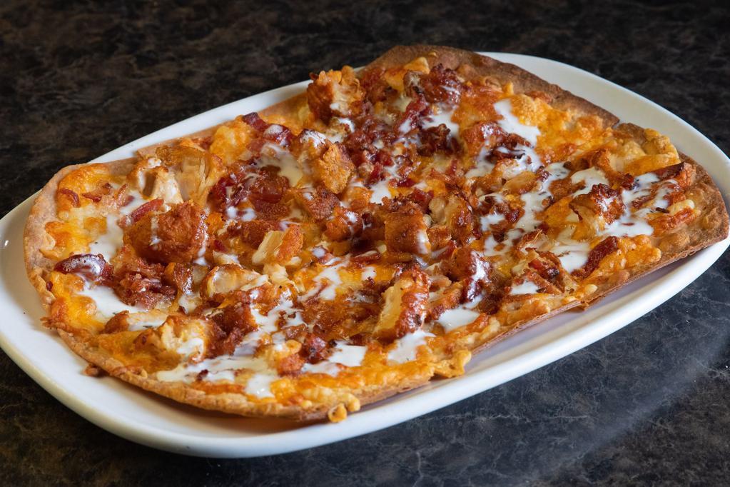 Chicken Bacon Ranch Flatbread · Cheddar Jack cheese, bacon and Gene's way chicken, drizzled with ranch.