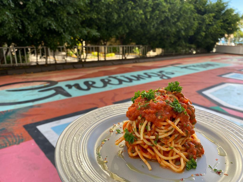 Arrabbita · Fresh Pasta tossed with Nonna's Classic Pomodoro, Tuscan Olive Oil,  Chili Flake and Parmesan. (VEGETARIAN)