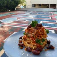 Puttanesca  · Fresh Pasta tossed with our Savory Pomodoro Sauce with Black Olives, Capers and Chili Flakes...