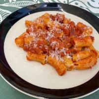 Amatriciana · Flavorful Pono Pork Guanciale and our Nonna's Tomato Sauce made in house and served over Fre...