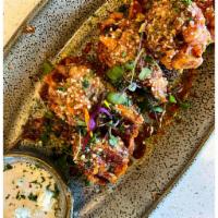Chicken Wings Plate · Homemade tangy BBQ sauce, chili oil, Parmesan, blue cheese.