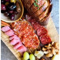 Ambassador Board Plate · Selection of 3 pieces artisanal cheeses and meats. Served with compotes, pickled vegetables,...