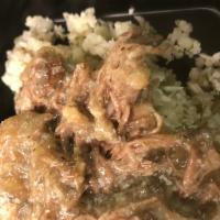 Coffee Braised Pot Roast · Slow cooked chuck roast in a coffee reduction and smothered with onions.  Served over caulif...