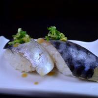 Mackerel Sushi · Sweet tuna like fish. Seaweed wrapped around rice and filling.  