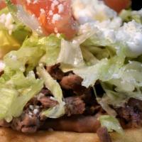 Sope · Refried beans, lettuce, pico de gallo, cheese or sour cream, and your choice of meat.