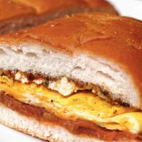 Breakfast Torta · Cheese, refried beans, scrambled eggs, and your choice of meat.