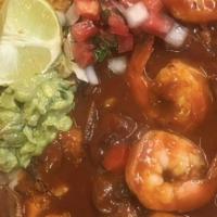 Camarones a La Diabla · Side of lettuce, pico, rice, beans, tortillas and shrimp smothered in spicy chile sauce and ...