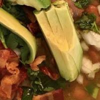 Carne en Su Jugo · Beef soup in savory tomatillo broth with asada, bacon, beans, avocado, and a side of veggie ...