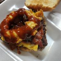 Smokehouse Western Burger and Fries  · Bacon, cheese, onion rings and BBQ sauce. 