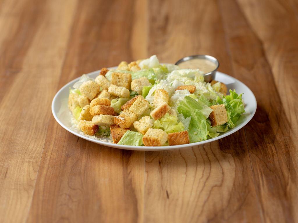 Caesar Salad · Romaine lettuce tossed with Parmesan cheese, croutons and our Caesar dressing. Add chicken for an additional charge.