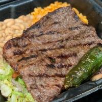 Asada Steak Plate · Thin steak, with rice and beans. 