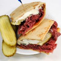 Hot Corned Beef and Cream Cheese Sandwich · Popular with pickles added.