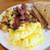 Breakfast Platter · 2 eggs scrambled with choice of meat brunch potatoes and toast.