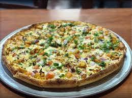 Chicken Curry Pizza · Chicken in curry sauce, onion, bell pepper, dice tomatoes, and mushroom.