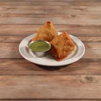 2 Pieces Vegetable Samosas · Warm crispy stuffed pastries of potatoes and green peas blended with Indian spices, perhaps ...