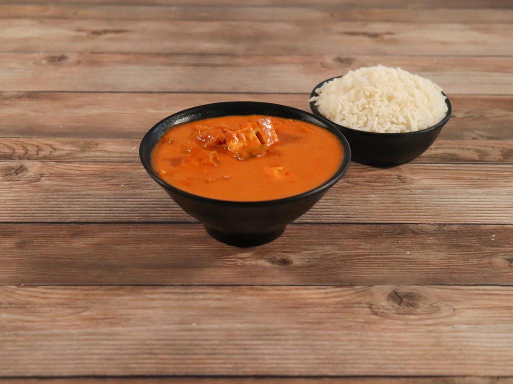 Paneer Tikka Masala · Chunks of cheese cooked in house special masala with sliced onions, tomatoes, ginger and bell peppers.