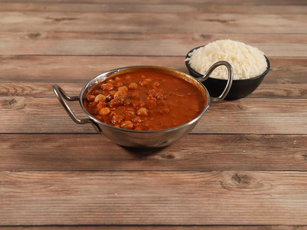 Chana Masala · Garbanzo beans cooked in fresh onions, tomato and numerous spices in a flavorful sauce.