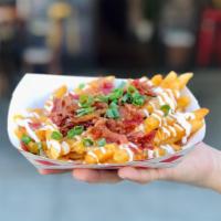 Bacon Cheese Fries · Crispy fries with our special spicy seasoning, drizzled with sour cream and dynamite sauce, ...