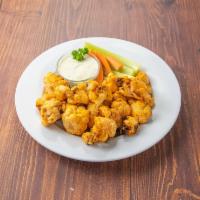Buffalo Cauliflower (V) (GF) · Roasted cauliflower tossed in a tangy Buffalo sauce with celery spears and bleu cheese dip.
