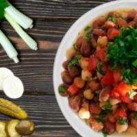 Ful Medammas Plate · Fava bean, tomato, parsley, lemon, garlic and olive oil. Vegetarian.