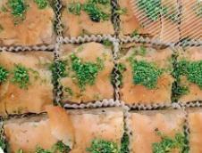 Baklava · Layers of filo filled with pistachios and sweetened with honey syrup.

