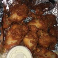 8 Wings · Bone in or boneless wings in your choice of Buffalo or BBQ sauce.