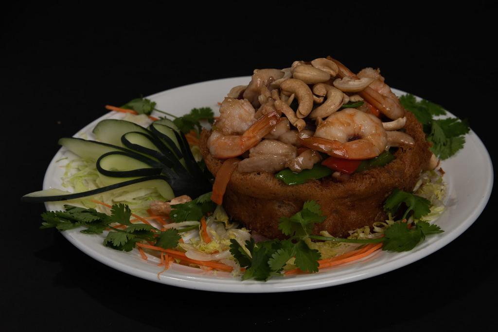C3. Sarang Burong · shaped fried taro stuffed w.chicken,shrimp,snow peas,mushroom,corn,red&green pepper topped w.cashew nuts.