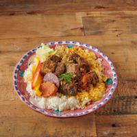 Carne de Res Guisada · Beef stew. Served with rice and beans  (black beans and rice) ( guandules Rice and peas yell...