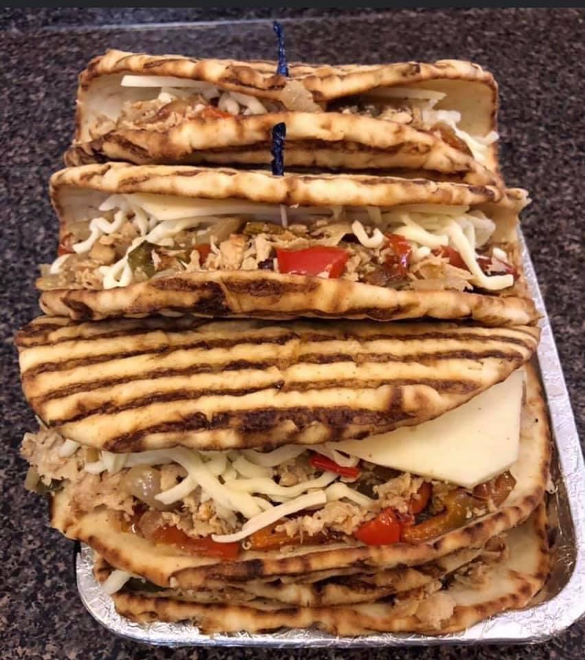 Italian Pesto Panini · Grilled chicken, basil pesto, marinated artichoke hearts, roasted red peppers, and Parmesan.