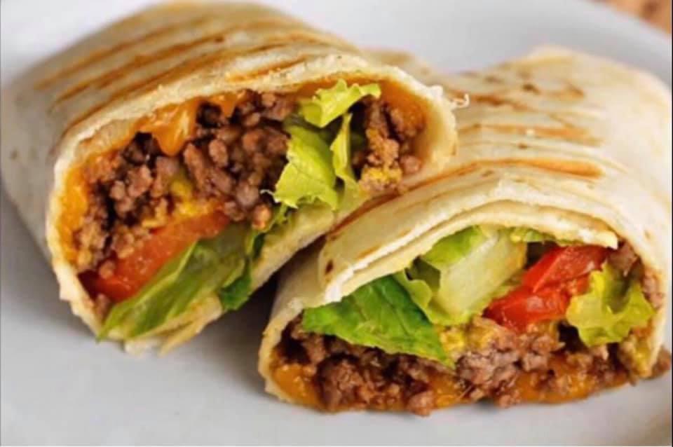 Taco Wrap · Seasoned ground beef, cheddar, lettuce, tomato, served with sour cream & salsa.