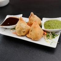 Vegetable Samosa · Crisp fried turnover, filled with delicious, mildly spiced potatoes and green peas.( 3 pcs)
