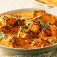 Chicken Tikka Masala · Chicken cubes cooked in tomato, onion sauce and spices.