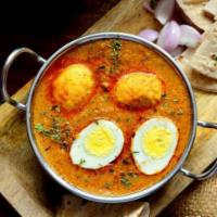 Egg Curry · Boiled eggs cooked with tomatoes, onions and spices.