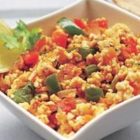 Egg Burji · Scrambled eggs gently cooked with tomatoes, onions and bell peppers with Indian spice.