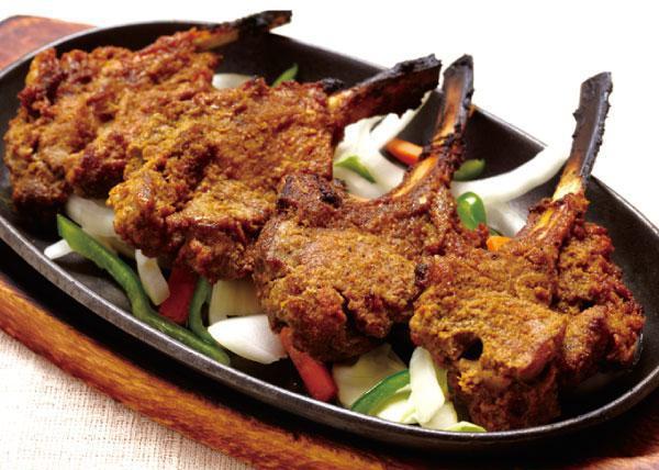 Lamb Chops · French cut lamb chops marinated in homemade spices served hot with different spice levels.