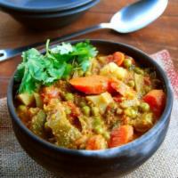 Mixed Vegetable Curry · Mixed vegetables cooked in tomatoes,onions and spices.