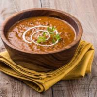 Dal Makhani · Lentils slow cooked with kidney beans, tomatoes and spices.