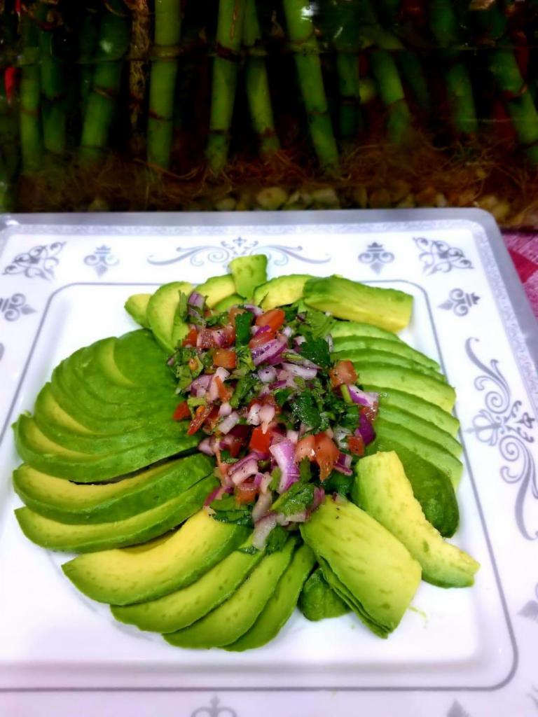 Avocado salad  · lemon juice,red onions ,olive oil ,black pepper, cilantro and salt