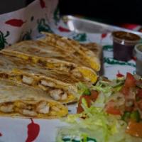 Kids Quesadilla · Cooked tortilla that is filled with cheese and folded in half. 