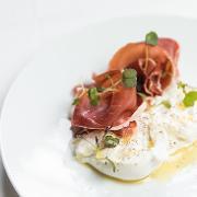 Burrata · Burrata cheese with prosciutto, mixed olives, roasted pepper, and balsamic vinegar.