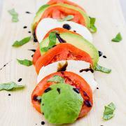 Caprese · Tomato, avocado, mozzarella, long hot, olives, and balsamic drizzle.